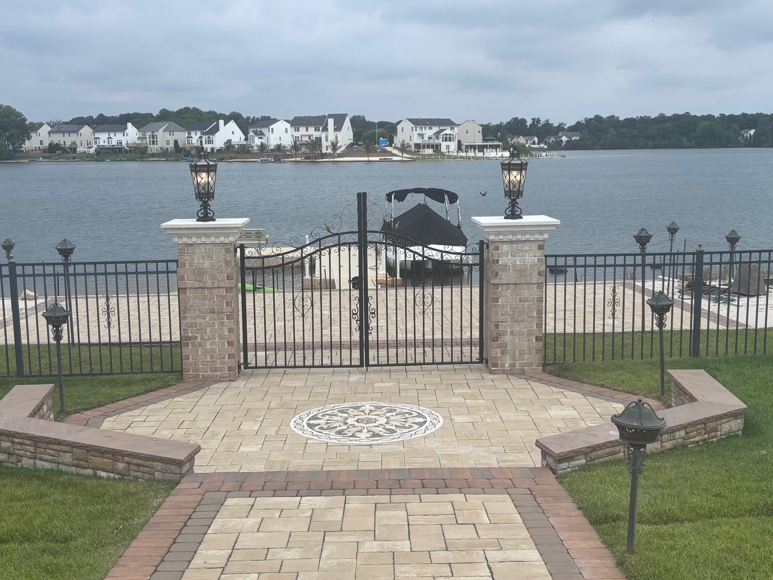 Completed waterfront entrance with decorative exterior lighting